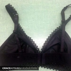 A close up of the bra strap on top of a bra