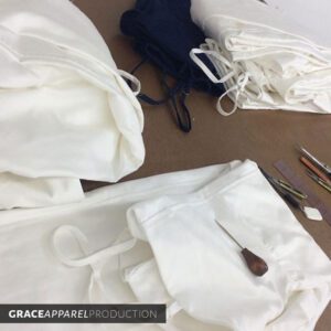 A table with some white fabric and scissors