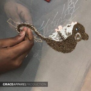 A person is working on an animal design.