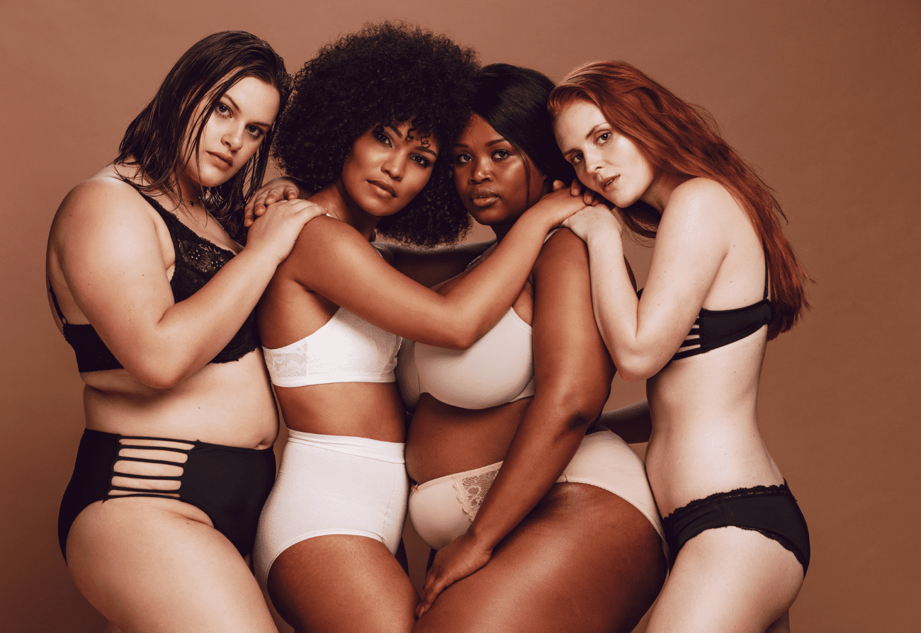 A group of women in lingerie posing for the camera.