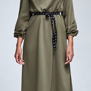 A woman in a long dress with polka dots