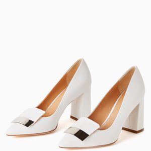 A pair of white shoes with a metal buckle on the front.