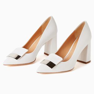 A pair of white shoes with a metal buckle on the front.