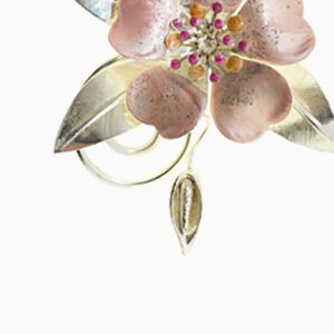 A close up of the flower on the back of a brooch