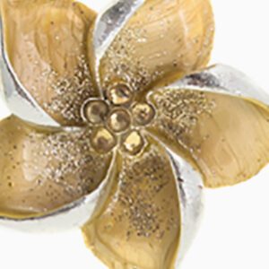 A close up of the flower with gold and silver petals.