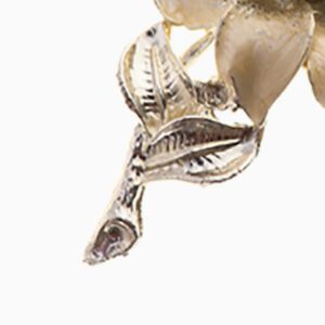 A close up of the metal leaf on a white background