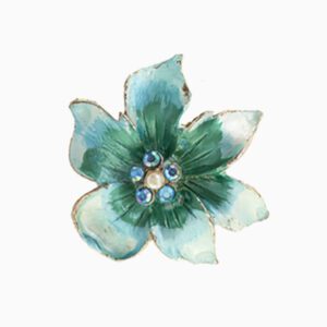 A blue flower with green leaves and blue beads.