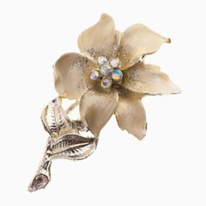A gold flower with some stones on it